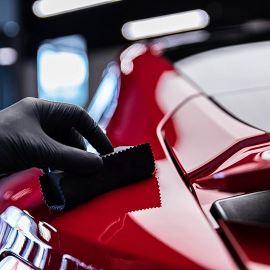 Application of ceramic coating in car detailing studio or car wash. Ceramic coating hollywood